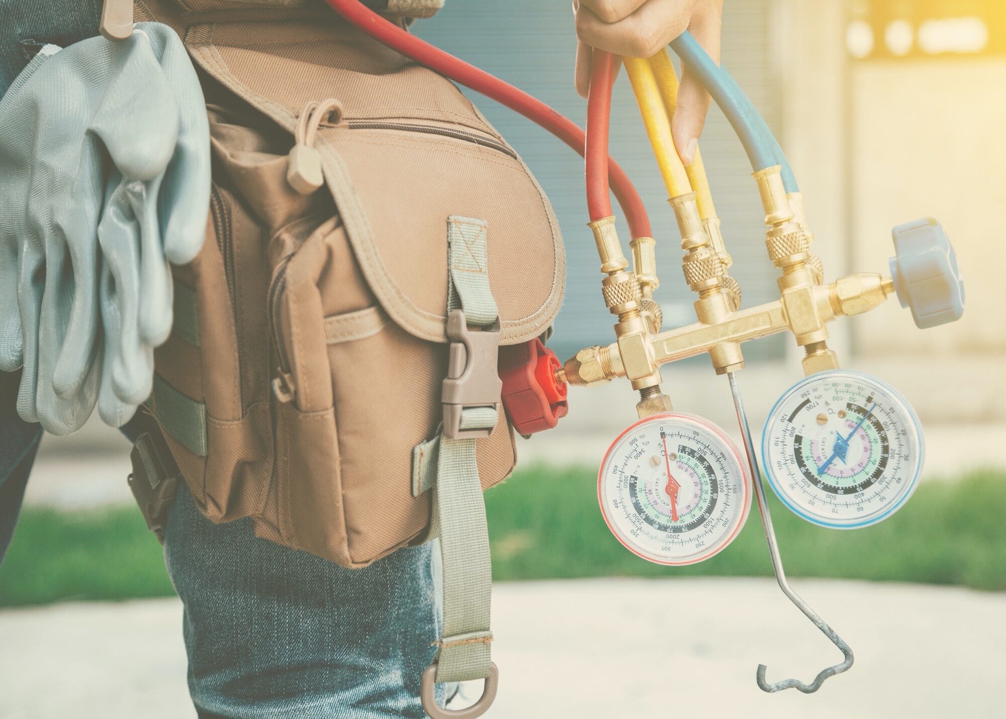 HVAC Worker holding gauges
